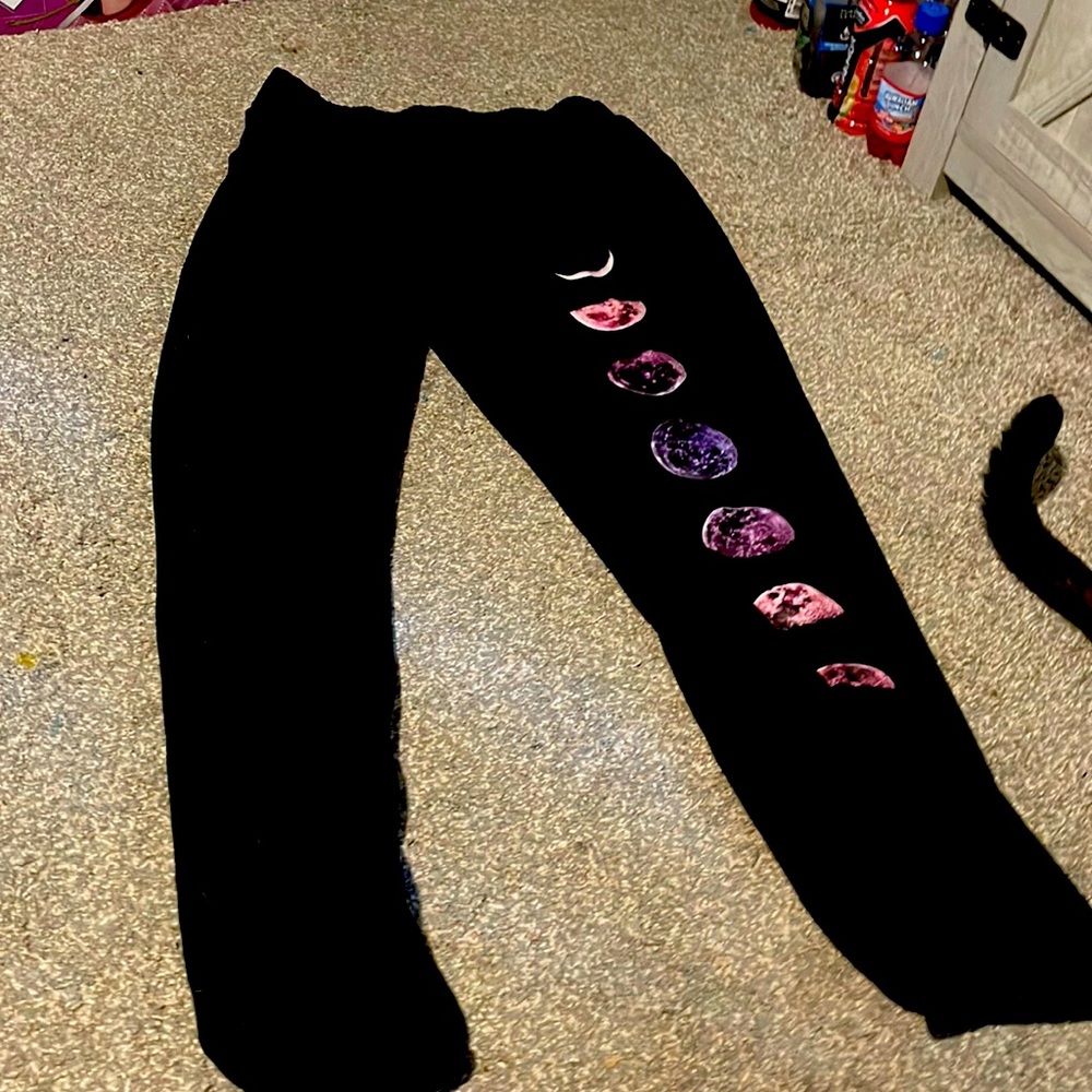 black Sweatpants with the moon cycle on right leg.